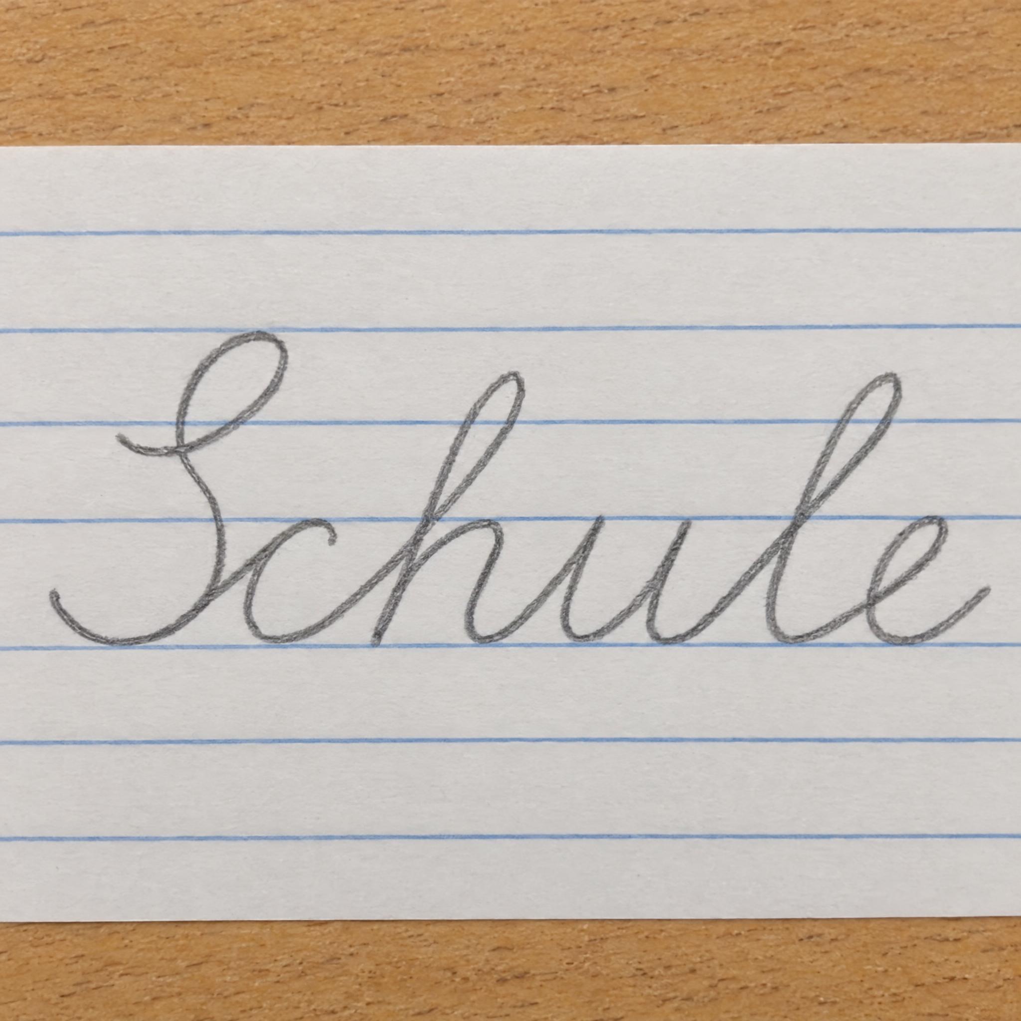 Schulschreibschrift KI-Schrift, erstellt mit GPT Image: das Wort Schule